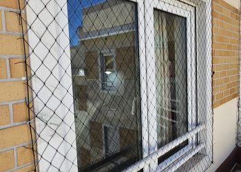Rede de proteção Protect4You aplicada em janela de apartamento